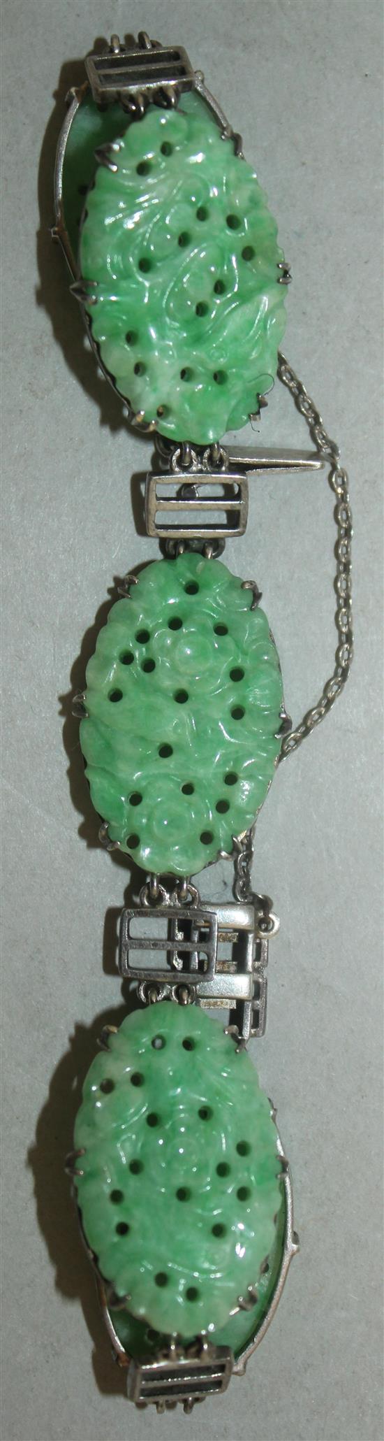 A Chinese jadeite and silver mounted bracelet, 20th century, each jadeite plaque approx. 2.5cm